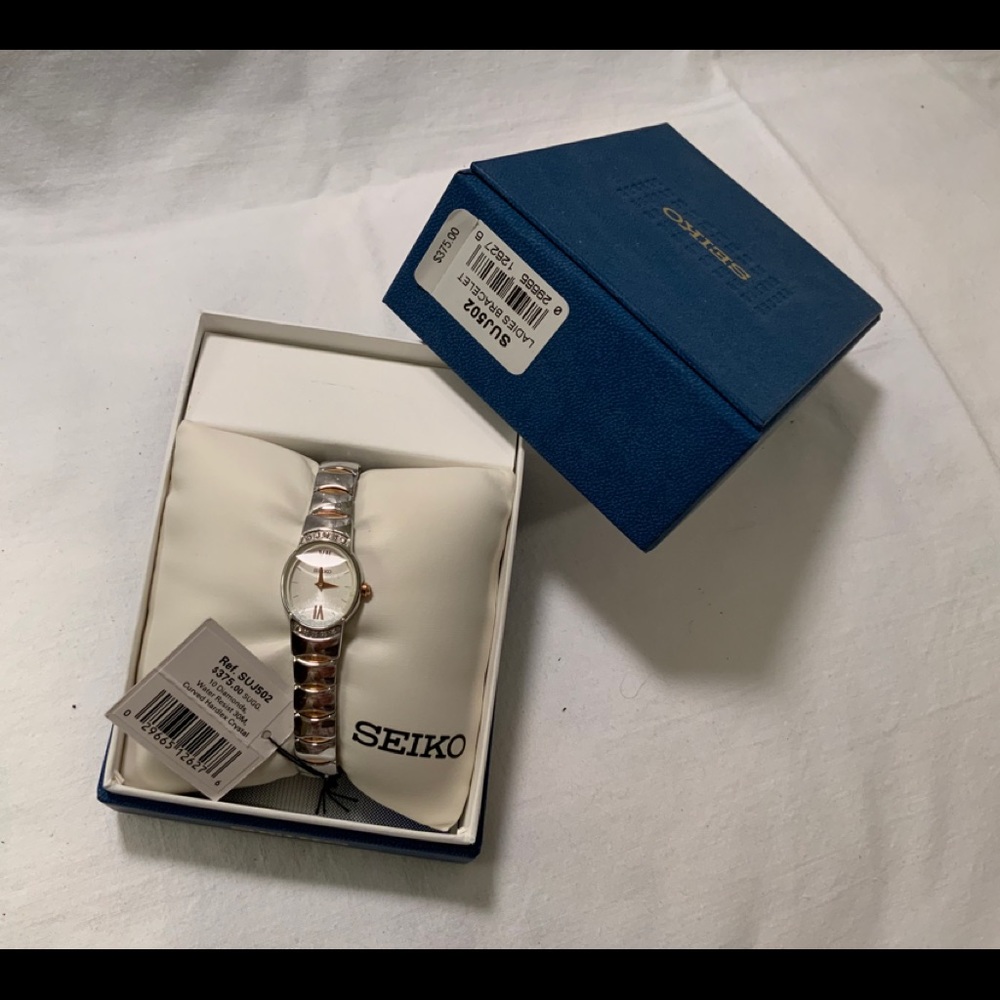 SEIKO two tone watch with diamonds in original box.